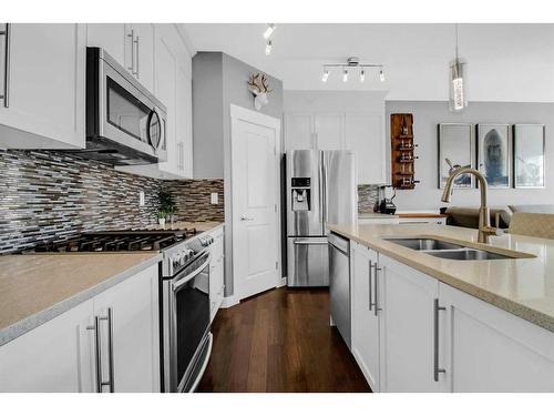 288 Rainbow Falls Green, Chestermere, AB - Indoor Photo Showing Kitchen With Stainless Steel Kitchen With Double Sink With Upgraded Kitchen