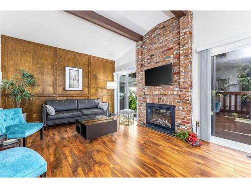 531 Cedarille Crescent Sw, Calgary, AB - Indoor Photo Showing Living Room With Fireplace