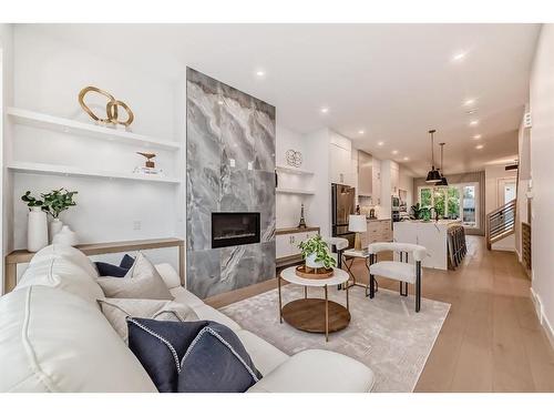 3717 2 Avenue Sw, Calgary, AB - Indoor Photo Showing Living Room With Fireplace