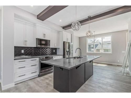 336 Waterford Boulevard, Chestermere, AB - Indoor Photo Showing Kitchen With Upgraded Kitchen