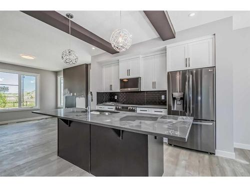 336 Waterford Boulevard, Chestermere, AB - Indoor Photo Showing Kitchen With Upgraded Kitchen