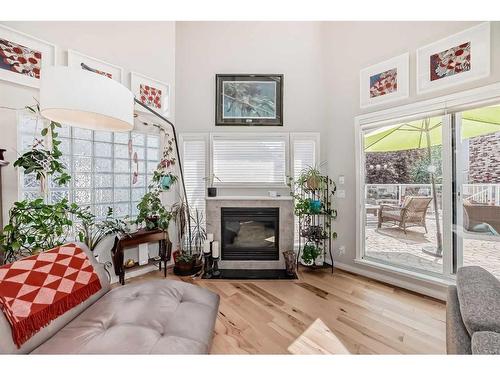 107-6650 Old Banff Coach Road Sw, Calgary, AB - Indoor Photo Showing Living Room With Fireplace