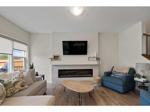 81 Legacy Reach Crescent Se, Calgary, AB - Indoor Photo Showing Living Room With Fireplace