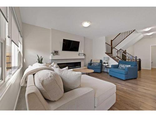 81 Legacy Reach Crescent Se, Calgary, AB - Indoor Photo Showing Living Room With Fireplace