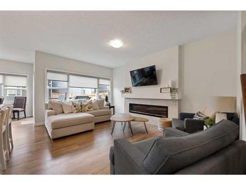 81 Legacy Reach Crescent Se, Calgary, AB - Indoor Photo Showing Living Room With Fireplace