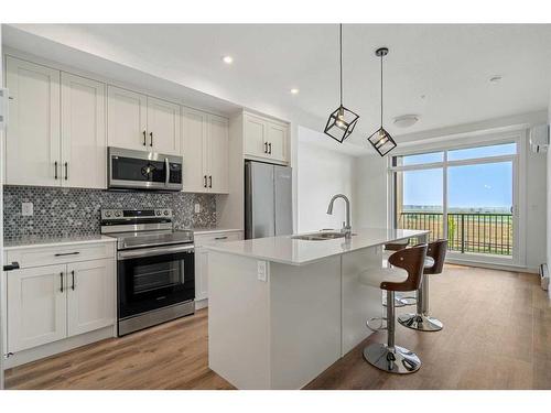 5208-200 Seton Circle Se, Calgary, AB - Indoor Photo Showing Kitchen With Stainless Steel Kitchen With Upgraded Kitchen