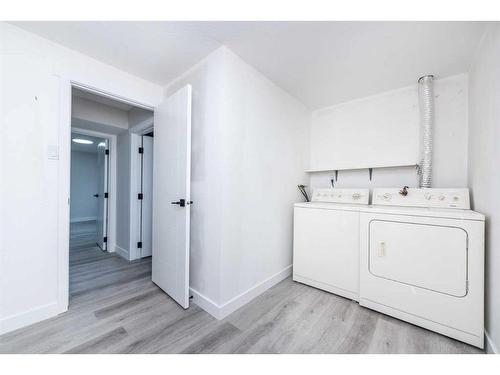 95 Holmwood Avenue Nw, Calgary, AB - Indoor Photo Showing Laundry Room