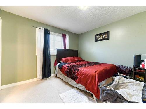 61 Cimarron Vista Gardens, Okotoks, AB - Indoor Photo Showing Bedroom