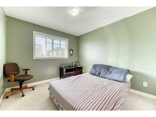 61 Cimarron Vista Gardens, Okotoks, AB - Indoor Photo Showing Bedroom