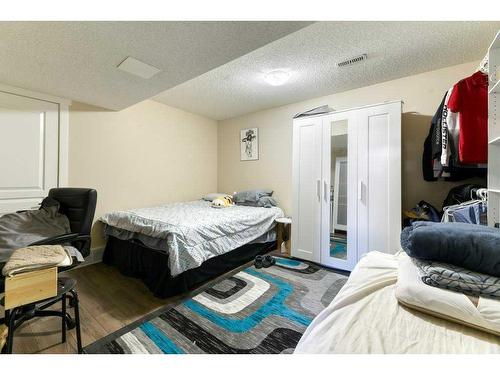 61 Cimarron Vista Gardens, Okotoks, AB - Indoor Photo Showing Bedroom