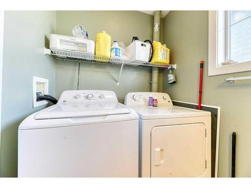 61 Cimarron Vista Gardens, Okotoks, AB - Indoor Photo Showing Laundry Room