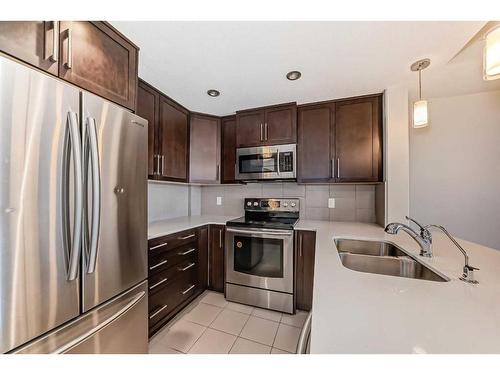 906-32 Varsity Estates Circle Nw, Calgary, AB - Indoor Photo Showing Kitchen With Stainless Steel Kitchen With Double Sink With Upgraded Kitchen