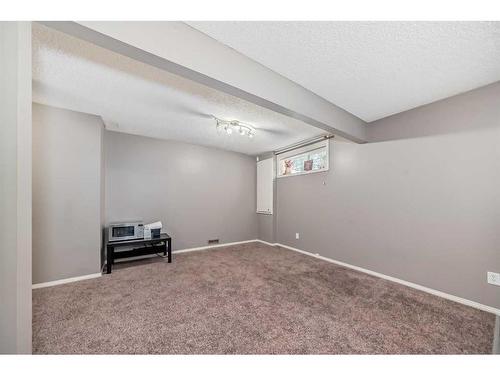 504 Saddlecrest Boulevard Ne, Calgary, AB - Indoor Photo Showing Other Room