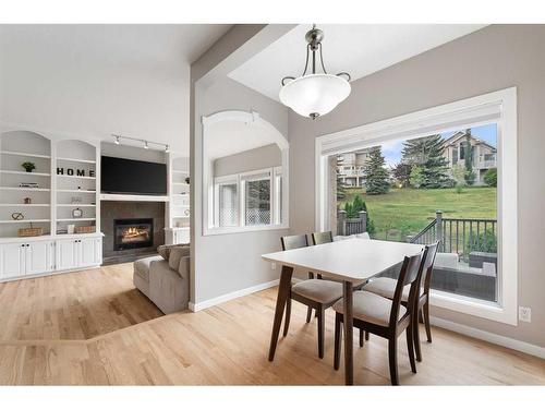 169 Patterson Boulevard Sw, Calgary, AB - Indoor Photo Showing Dining Room With Fireplace