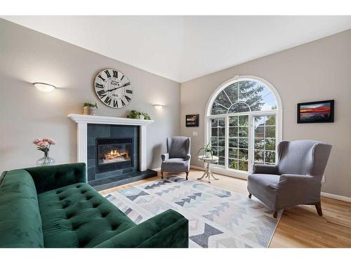 169 Patterson Boulevard Sw, Calgary, AB - Indoor Photo Showing Living Room With Fireplace