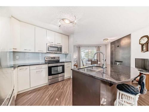 26-2318 17 Street Se, Calgary, AB - Indoor Photo Showing Kitchen With Double Sink