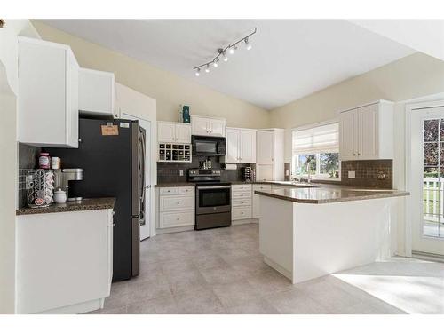 704 Woodside Drive Nw, Airdrie, AB - Indoor Photo Showing Kitchen