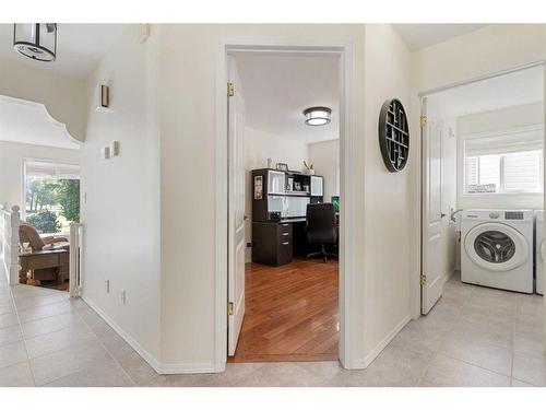 704 Woodside Drive Nw, Airdrie, AB - Indoor Photo Showing Laundry Room