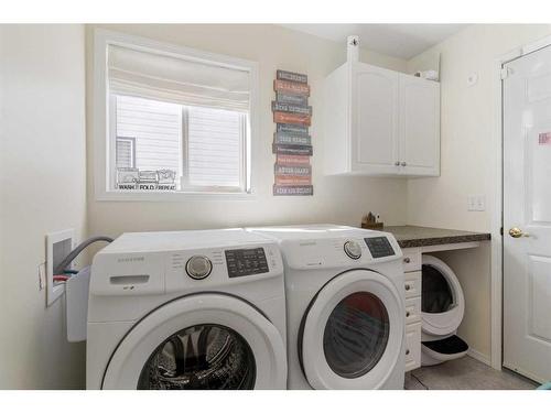 704 Woodside Drive Nw, Airdrie, AB - Indoor Photo Showing Laundry Room