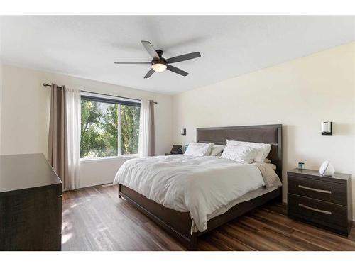 704 Woodside Drive Nw, Airdrie, AB - Indoor Photo Showing Bedroom