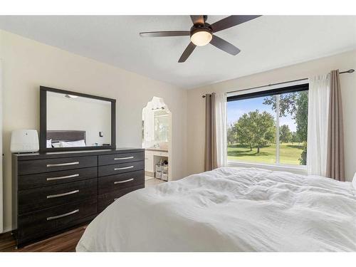 704 Woodside Drive Nw, Airdrie, AB - Indoor Photo Showing Bedroom