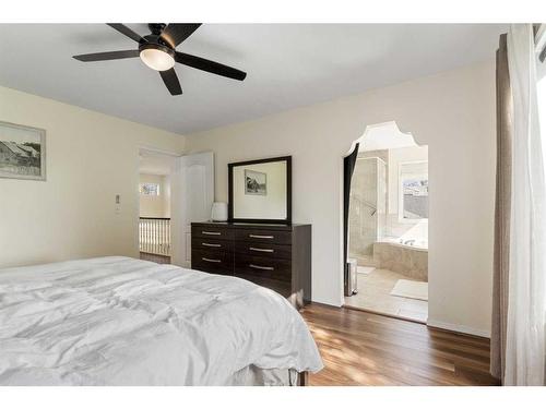 704 Woodside Drive Nw, Airdrie, AB - Indoor Photo Showing Bedroom