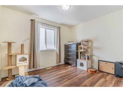 704 Woodside Drive Nw, Airdrie, AB - Indoor Photo Showing Bedroom