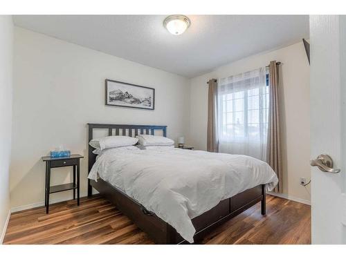 704 Woodside Drive Nw, Airdrie, AB - Indoor Photo Showing Bedroom