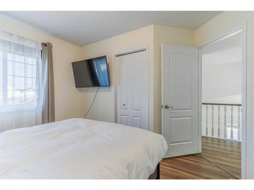 704 Woodside Drive Nw, Airdrie, AB - Indoor Photo Showing Bedroom