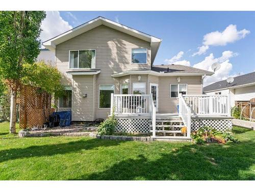 704 Woodside Drive Nw, Airdrie, AB - Outdoor With Deck Patio Veranda