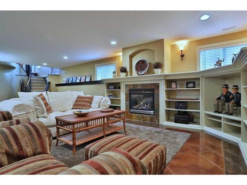 53 Westpoint Way Sw, Calgary, AB - Indoor Photo Showing Living Room With Fireplace