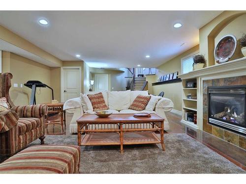 53 Westpoint Way Sw, Calgary, AB - Indoor Photo Showing Living Room With Fireplace