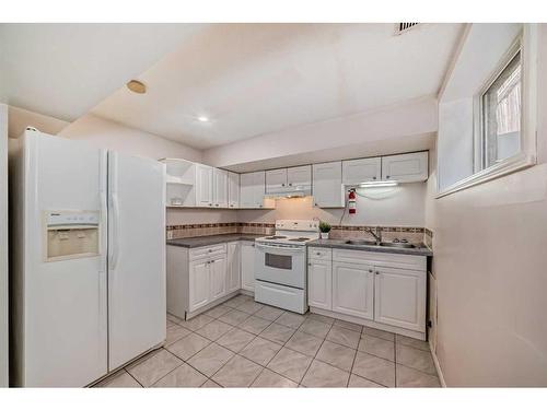 1059 Abbeydale Drive Ne, Calgary, AB - Indoor Photo Showing Kitchen With Double Sink