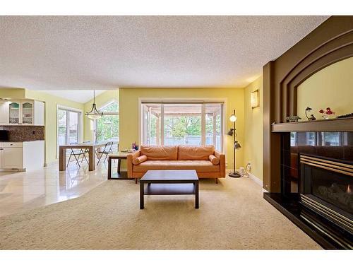 132 Evergreen Close Sw, Calgary, AB - Indoor Photo Showing Living Room With Fireplace