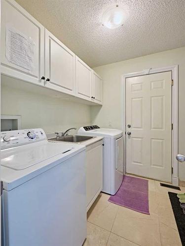 132 Evergreen Close Sw, Calgary, AB - Indoor Photo Showing Laundry Room