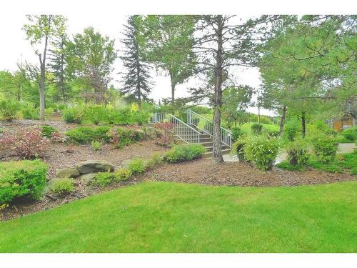 103-11642 Valley Ridge Park Nw, Calgary, AB - Outdoor With Backyard