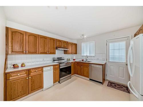 3327 28 Street Se, Calgary, AB - Indoor Photo Showing Kitchen With Double Sink