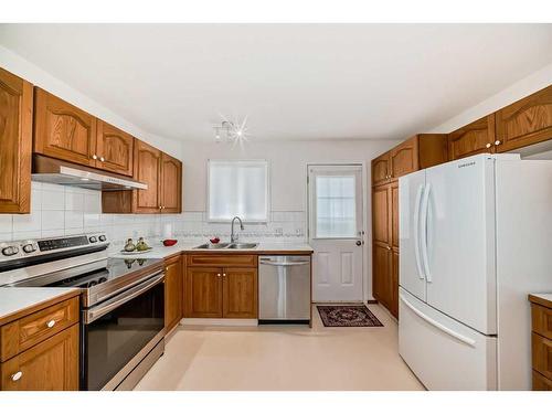 3327 28 Street Se, Calgary, AB - Indoor Photo Showing Kitchen With Double Sink