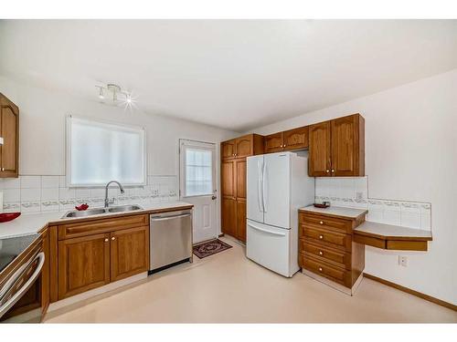 3327 28 Street Se, Calgary, AB - Indoor Photo Showing Kitchen With Double Sink