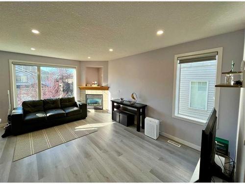 72 Rocky Vista Circle Nw, Calgary, AB - Indoor Photo Showing Living Room With Fireplace