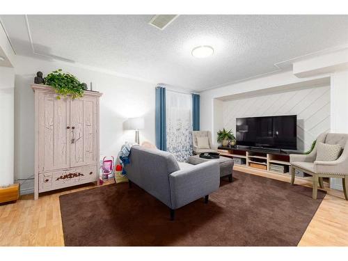 192 Hidden Spring Circle Nw, Calgary, AB - Indoor Photo Showing Living Room