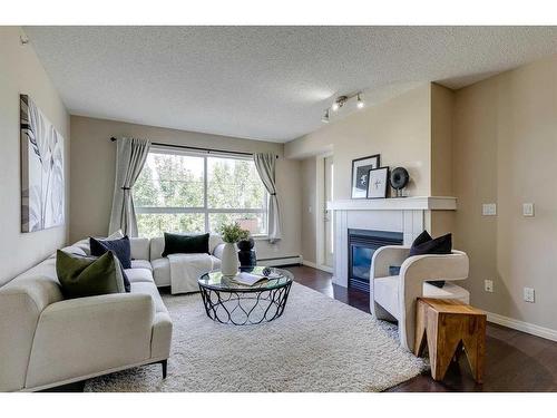 408-5115 Richard Road Sw, Calgary, AB - Indoor Photo Showing Living Room With Fireplace