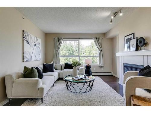 408-5115 Richard Road Sw, Calgary, AB - Indoor Photo Showing Living Room With Fireplace