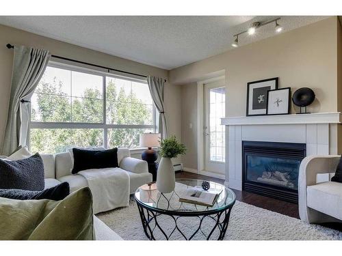 408-5115 Richard Road Sw, Calgary, AB - Indoor Photo Showing Living Room With Fireplace