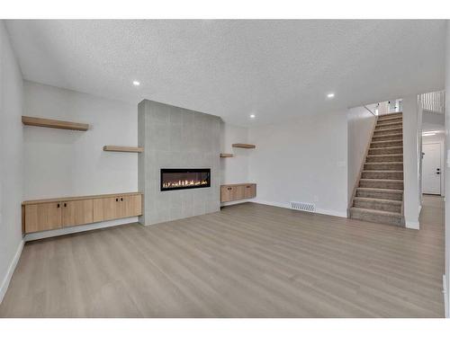 63 Martinview Crescent Ne, Calgary, AB - Indoor With Fireplace