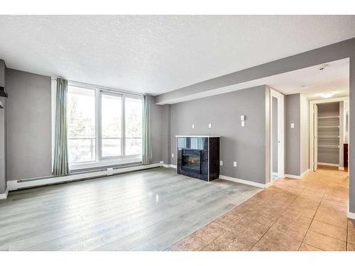 207-429 14 Street Nw, Calgary, AB - Indoor With Fireplace