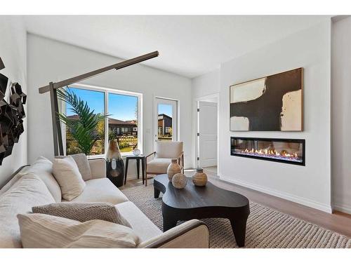 211 Marina Cove Se, Calgary, AB - Indoor Photo Showing Living Room With Fireplace