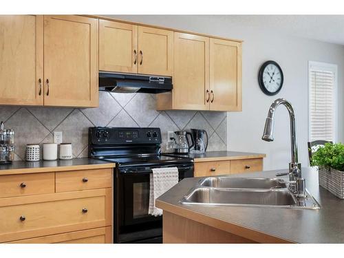 13 Brightondale Park Se, Calgary, AB - Indoor Photo Showing Kitchen With Double Sink