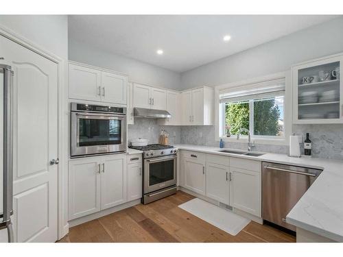 15 Cougar Ridge View Sw, Calgary, AB - Indoor Photo Showing Kitchen With Double Sink