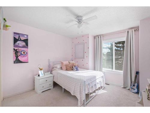 15 Cougar Ridge View Sw, Calgary, AB - Indoor Photo Showing Bedroom